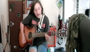 Tally Smith (aged 12), playing Wish You Were Here by Pink Floyd on the guitar