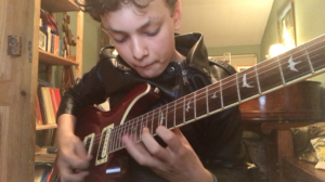 Ti-Jean Martin (age 13) riffing along on the guitar to Sweet Emotion by Aerosmith.